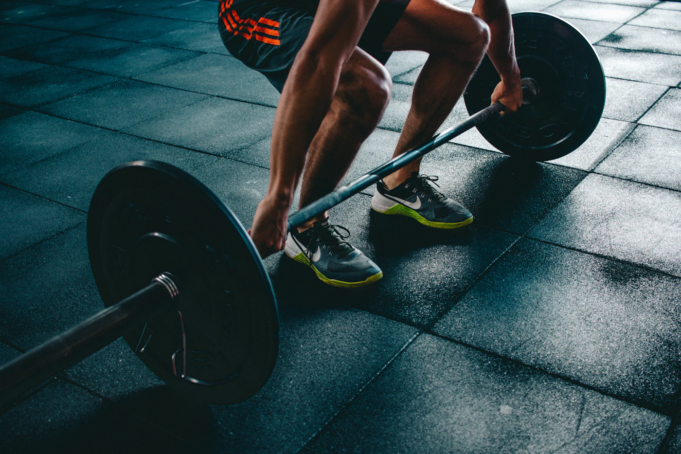 An athlete preparing to train with free weights